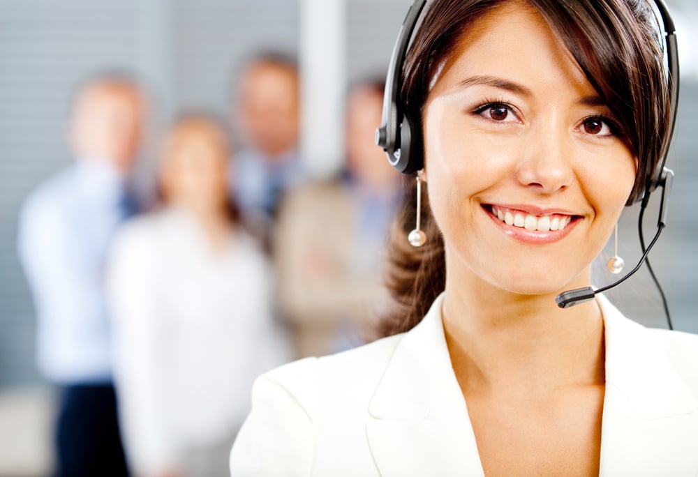 Female customer support operator with headset and smiling-1